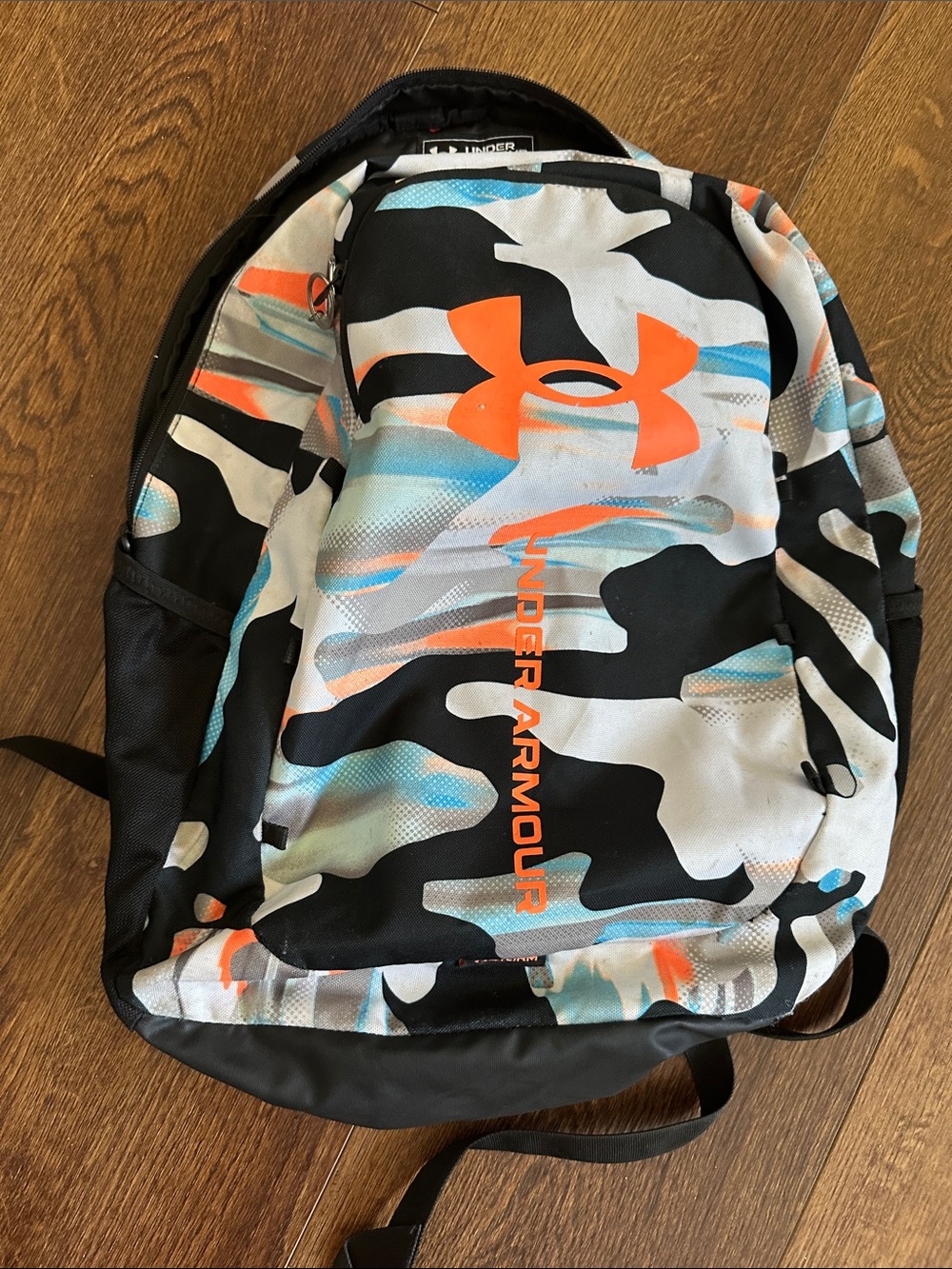 Under Armour Camo Backpack in Black, White & Orange with Blue Accents